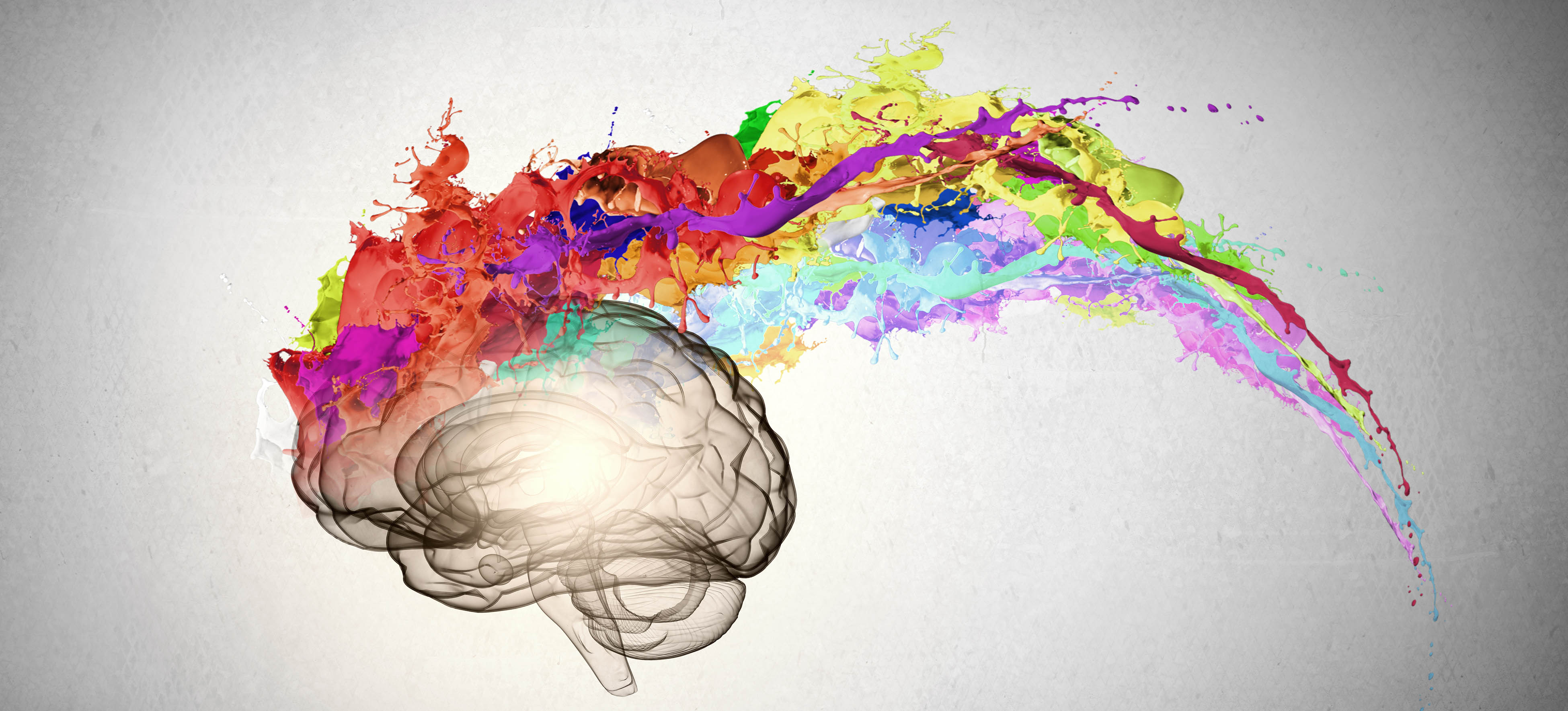 Illustration of a brain with a rainbow of colours exploding out of it